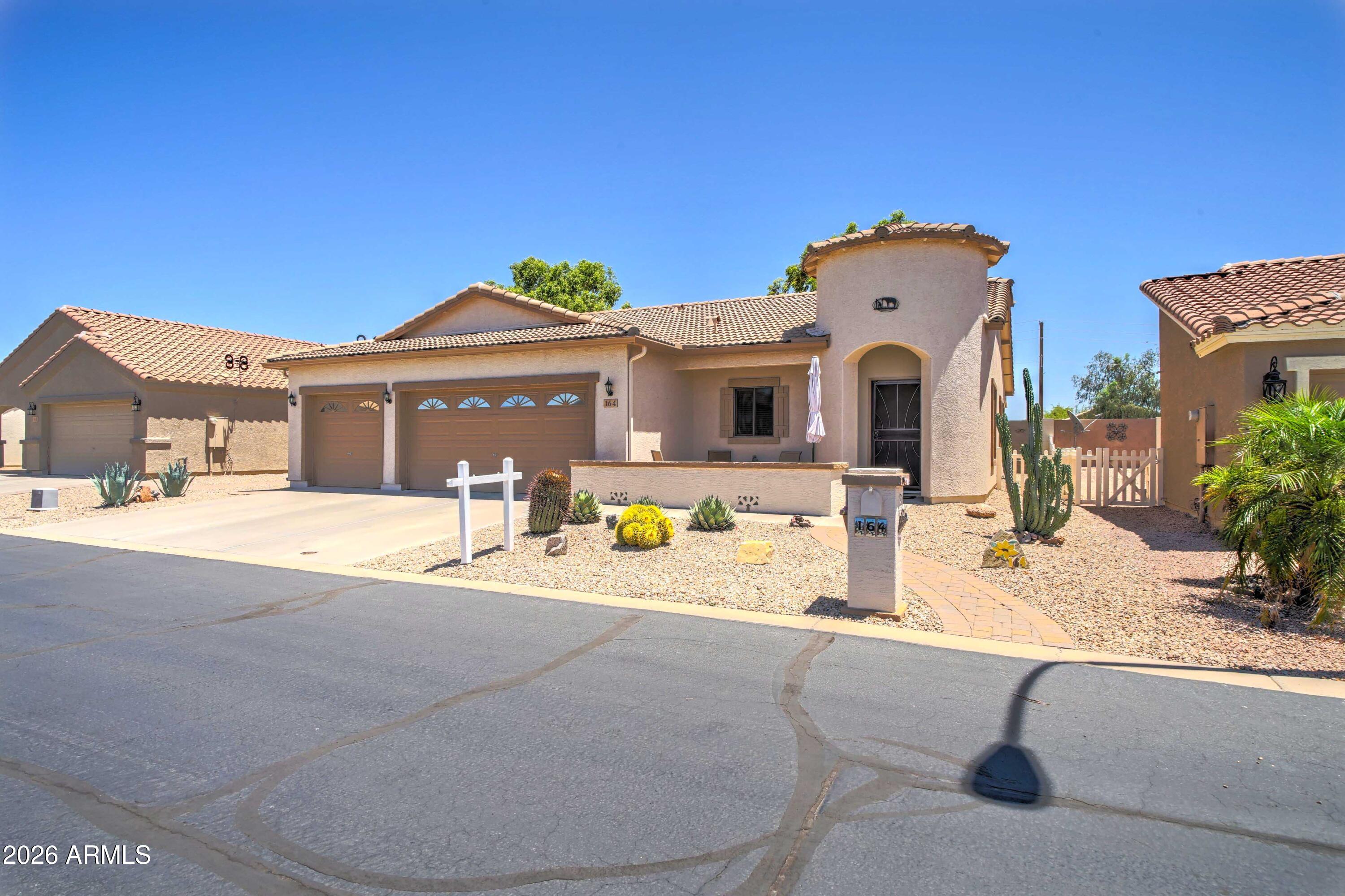 2101 South Meridian Road, Unit 164 Apache Junction, AZ 85120 - Photo 2 of 56 a view of a house with outdoor space and swimming pool