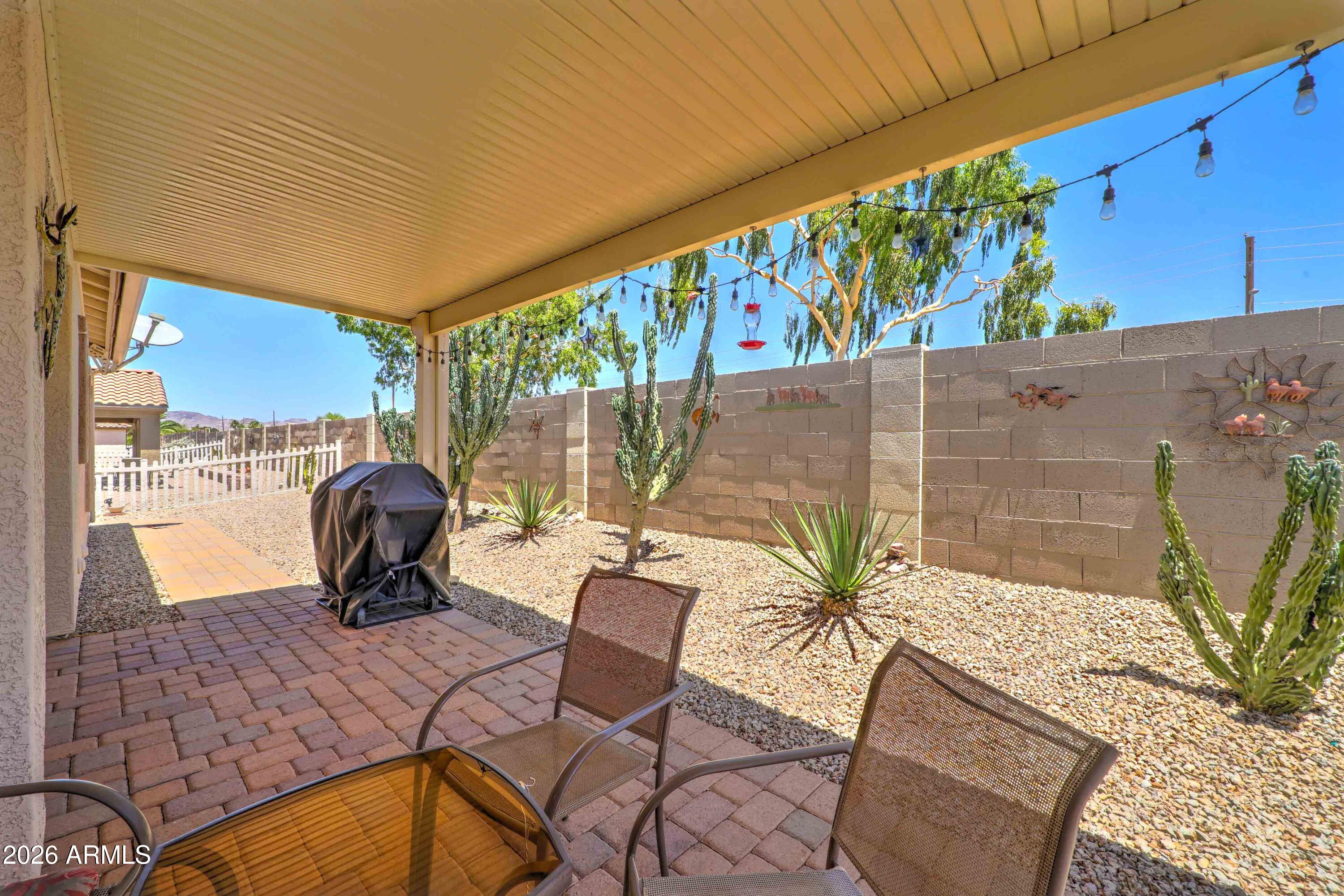 2101 South Meridian Road, Unit 164 Apache Junction, AZ 85120 - Photo 23 of 56 a view of a chairs and table in patio