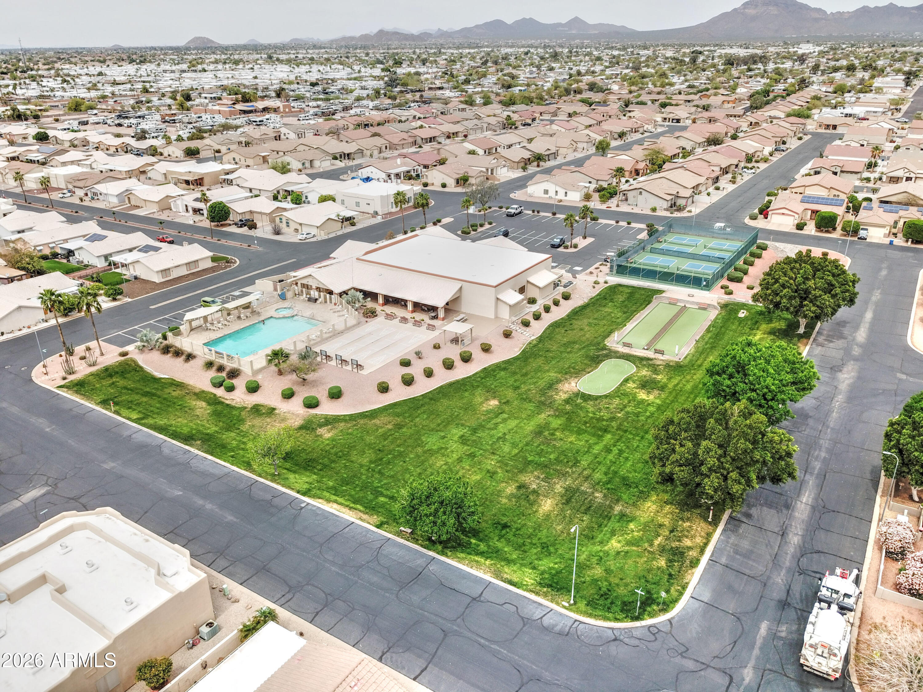 2101 South Meridian Road, Unit 164 Apache Junction, AZ 85120 - Photo 27 of 56 an aerial view of residential houses with outdoor space