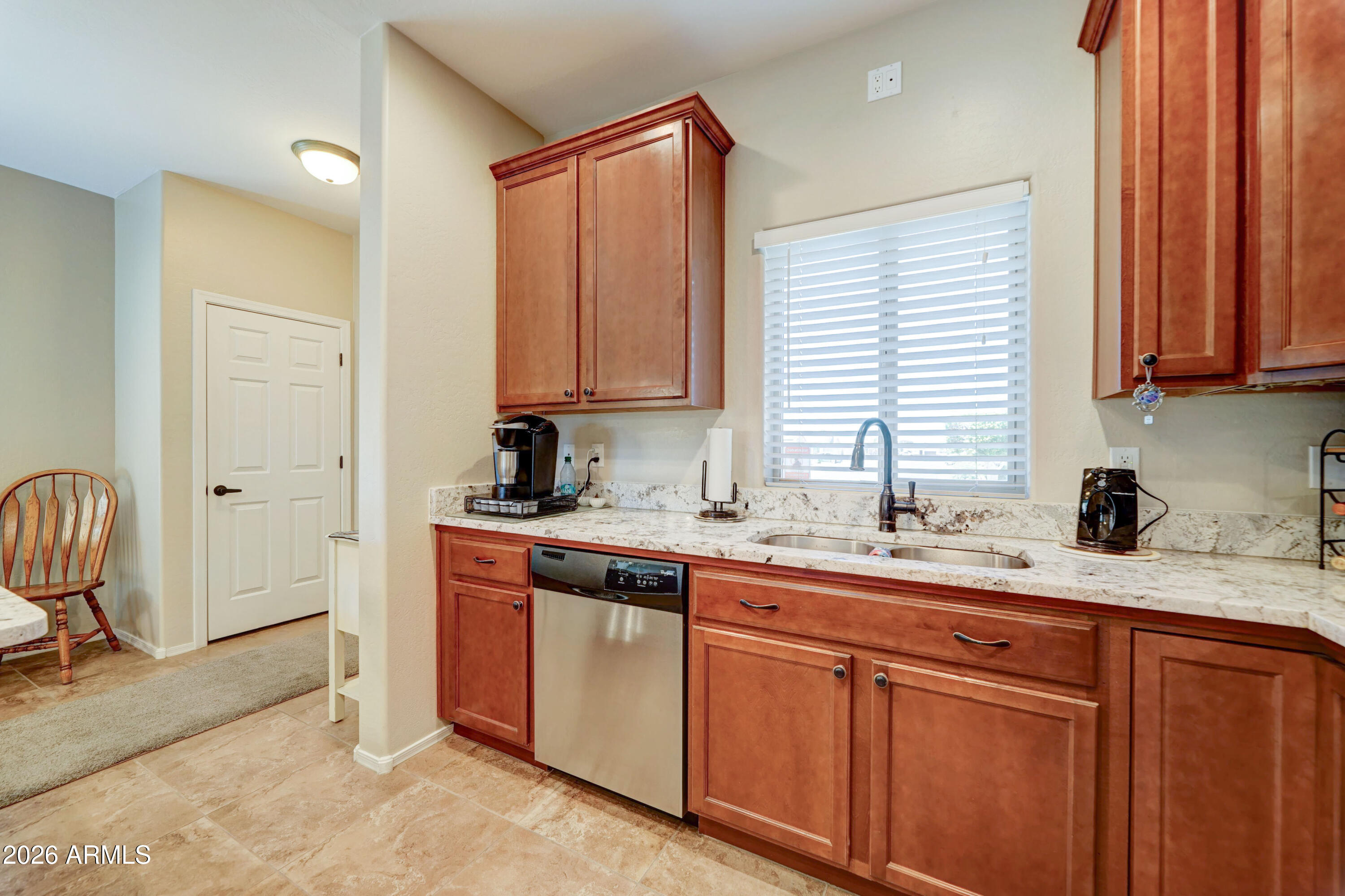 2101 South Meridian Road, Unit 164 Apache Junction, AZ 85120 - Photo 6 of 56 a kitchen with a sink cabinets and window