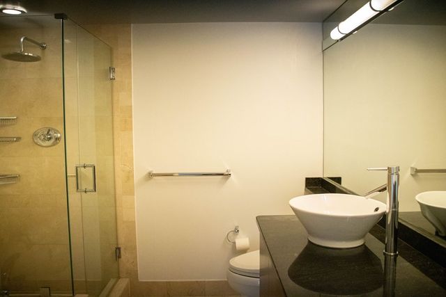 a bathroom with a table and a mirror