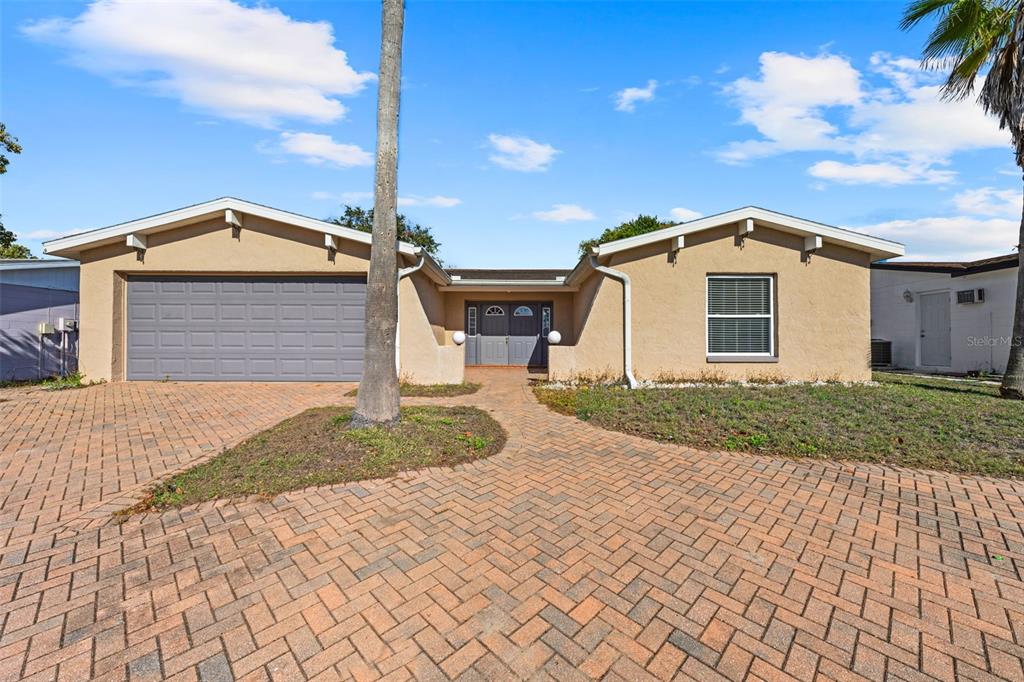 8615 Newton Drive Port Richey, FL 34668 - Photo 1 of 1 a front view of a house with a yard