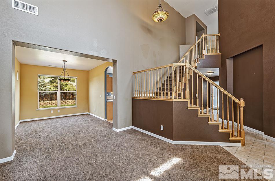 9550 Oakley Lane Reno, NV 89521 - Photo 3 of 20 a view of an entryway with staircase