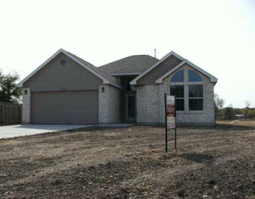 16802 Gravesend Road Pflugerville, TX 78660 - Photo 1 of 1 a front view of a house with a yard