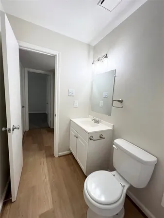 a white toilet sitting next to a bathroom sink
