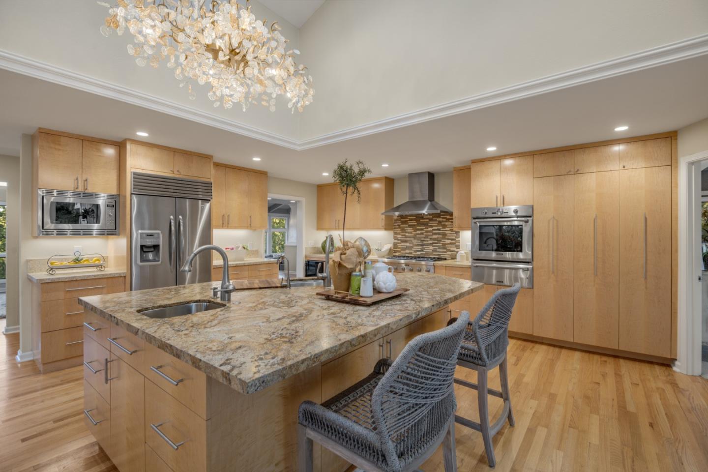 15076 Elm Park Monte Sereno, CA 95030 - Photo 17 of 68 a kitchen with granite countertop kitchen island stainless steel appliances a sink and refrigerator