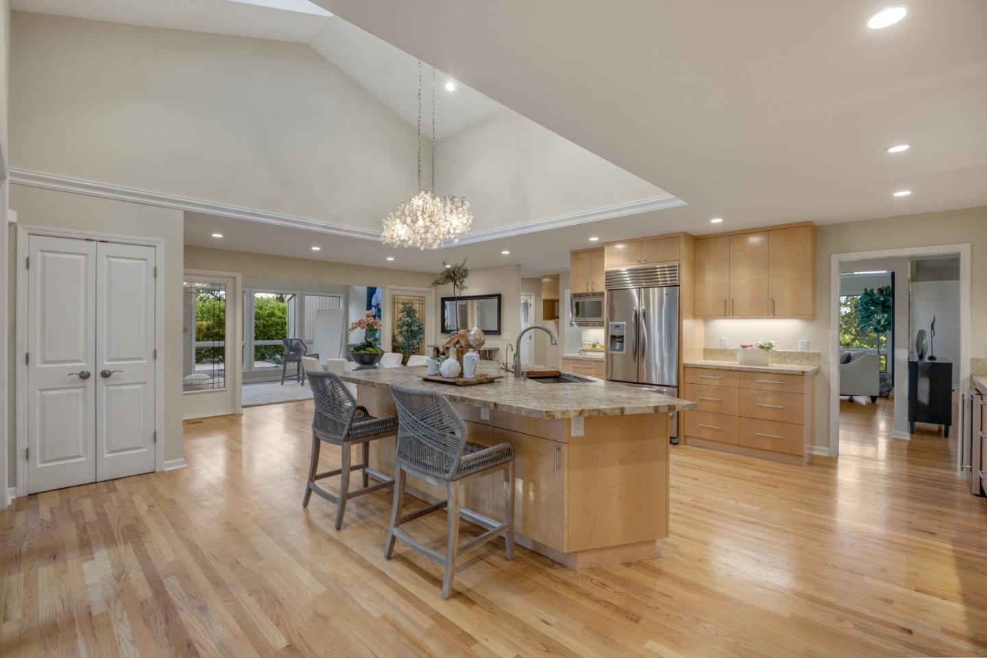 15076 Elm Park Monte Sereno, CA 95030 - Photo 24 of 68 a dining hall with stainless steel appliances granite countertop a couch dining table chairs and view living room