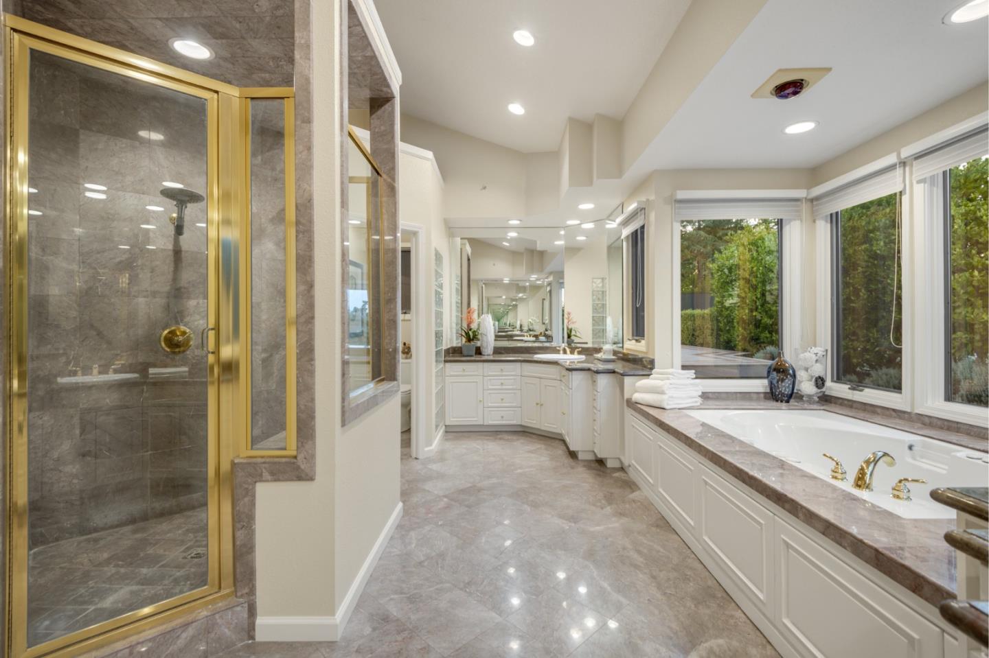 15076 Elm Park Monte Sereno, CA 95030 - Photo 35 of 68 a large white bathroom with a granite countertop tub sink a mirror and a shower