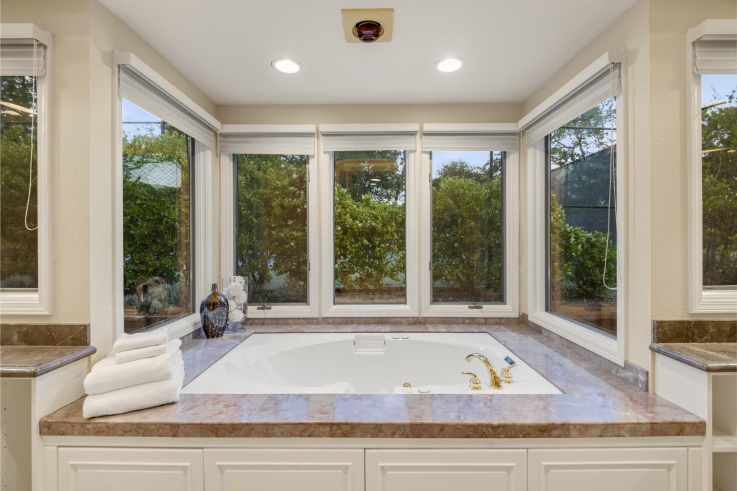 15076 Elm Park Monte Sereno, CA 95030 - Photo 36 of 68 a living room with couch and windows