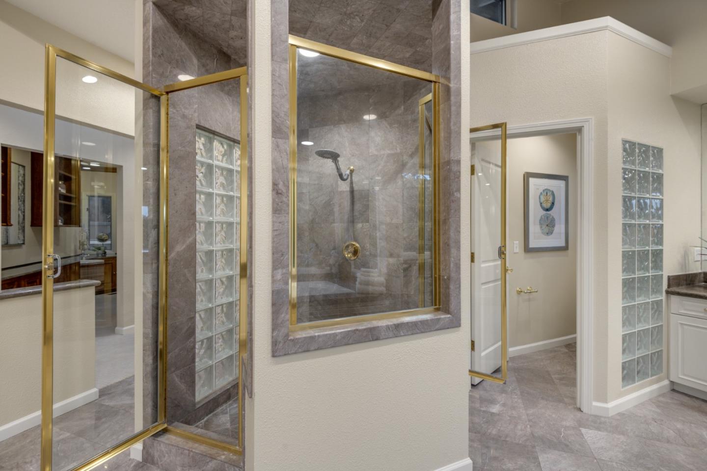 15076 Elm Park Monte Sereno, CA 95030 - Photo 37 of 68 a bathroom with a glass shower door and a mirror