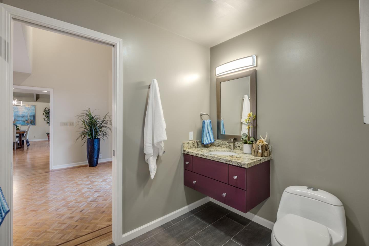 15076 Elm Park Monte Sereno, CA 95030 - Photo 41 of 68 a bathroom with a toilet sink and mirror