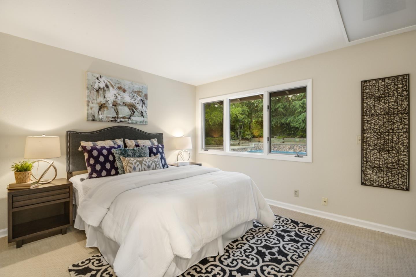 15076 Elm Park Monte Sereno, CA 95030 - Photo 44 of 68 a bedroom with a bed and a window