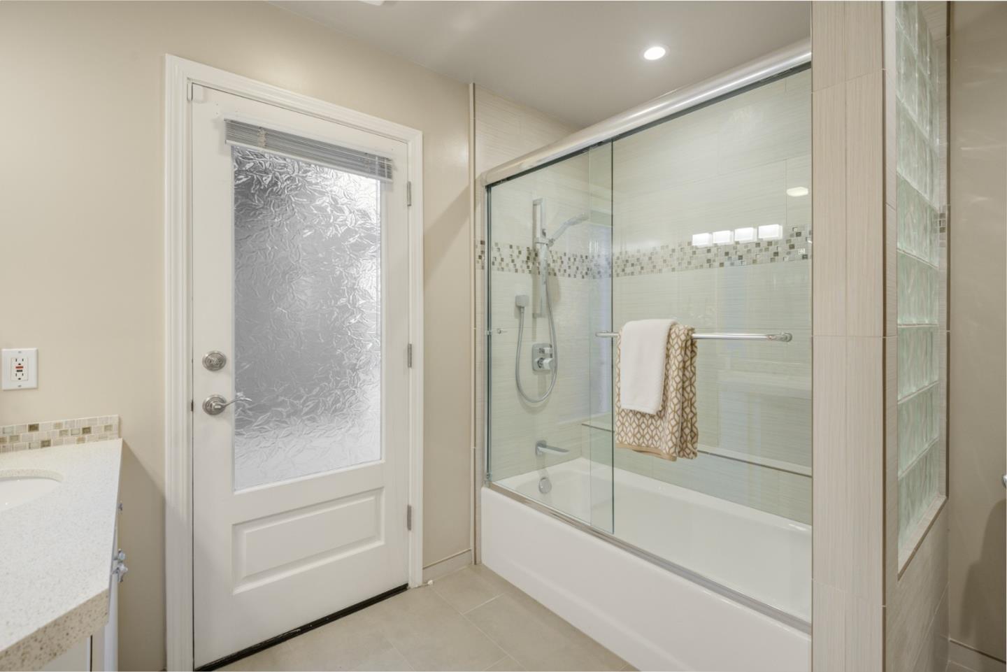 15076 Elm Park Monte Sereno, CA 95030 - Photo 48 of 68 a bathroom with a bathtub and a shower