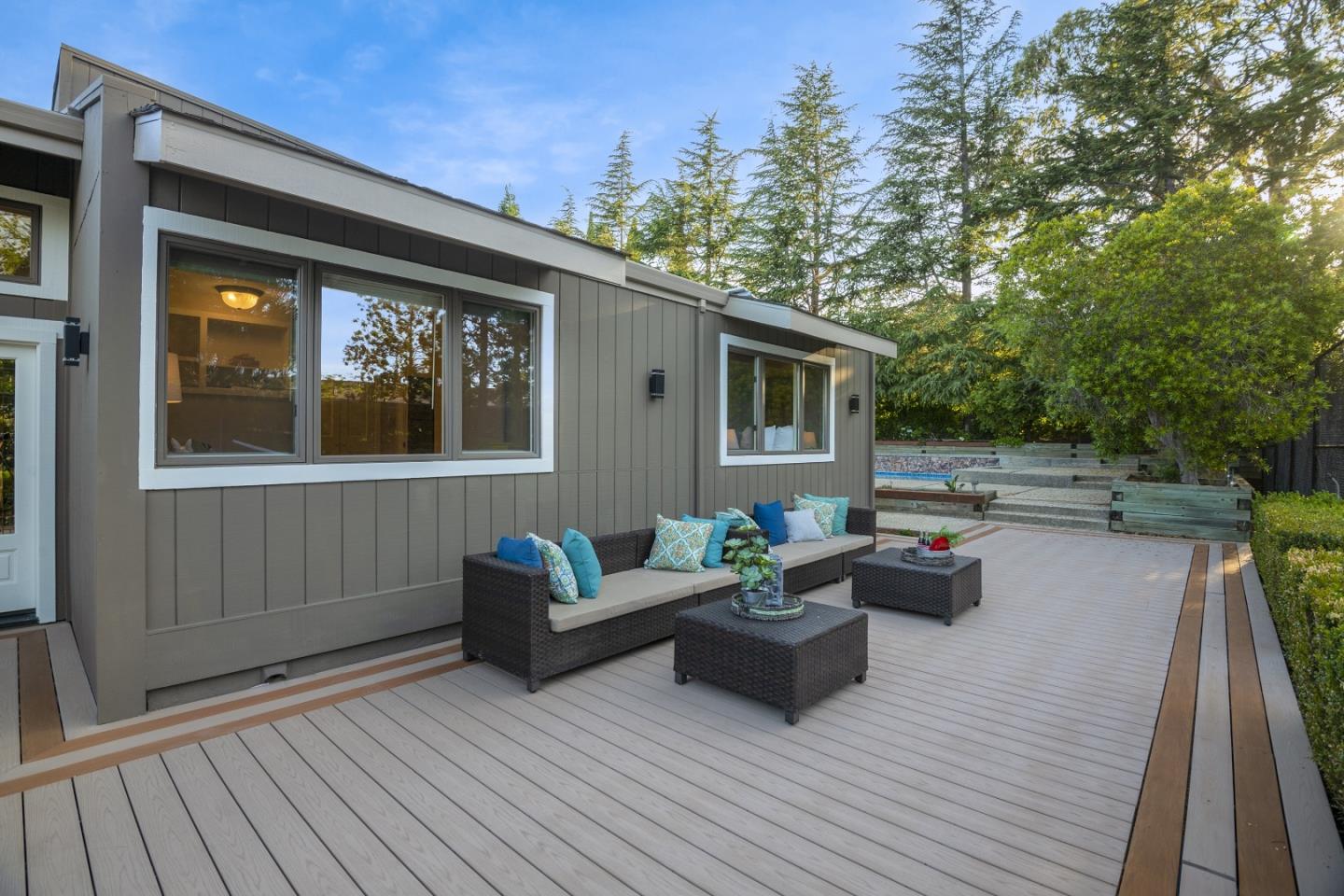 15076 Elm Park Monte Sereno, CA 95030 - Photo 56 of 68 a living room with patio furniture and a wooden floor