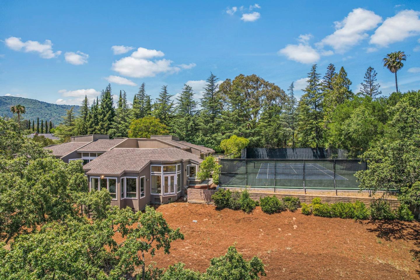 15076 Elm Park Monte Sereno, CA 95030 - Photo 63 of 68 a front view of a house with a yard and potted plants