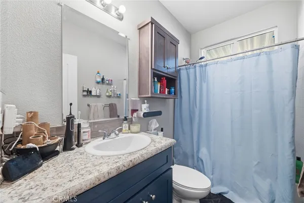 a kitchen with a stove and a window