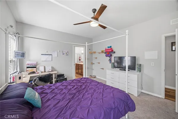 a bedroom with a bed and a table