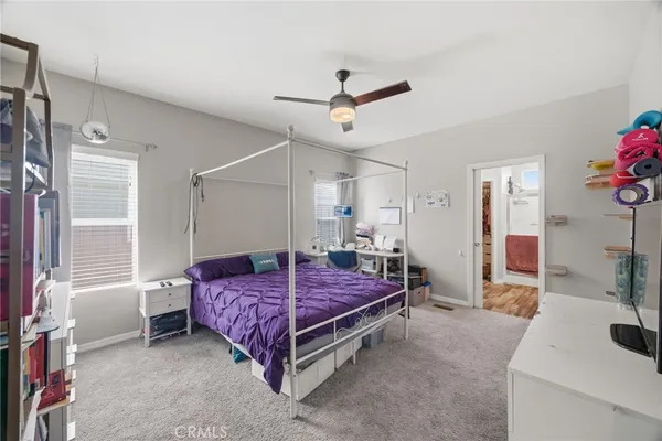 a bedroom with a bed and a table in it