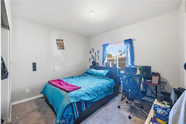 a bedroom with a bed and a toys