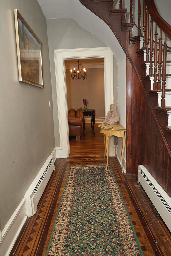 1406 Bluff Street Peru, IL 61354 - Photo 12 of 57 a living room with furniture and a rug