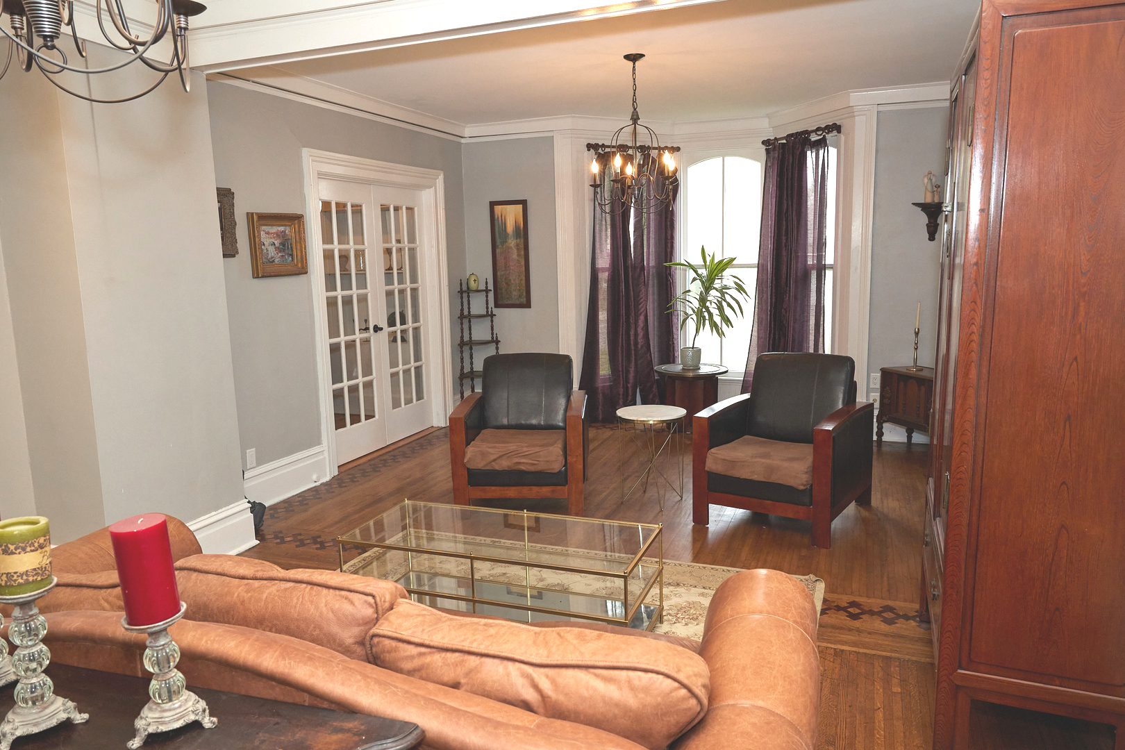 1406 Bluff Street Peru, IL 61354 - Photo 19 of 57 a living room with furniture and a chandelier