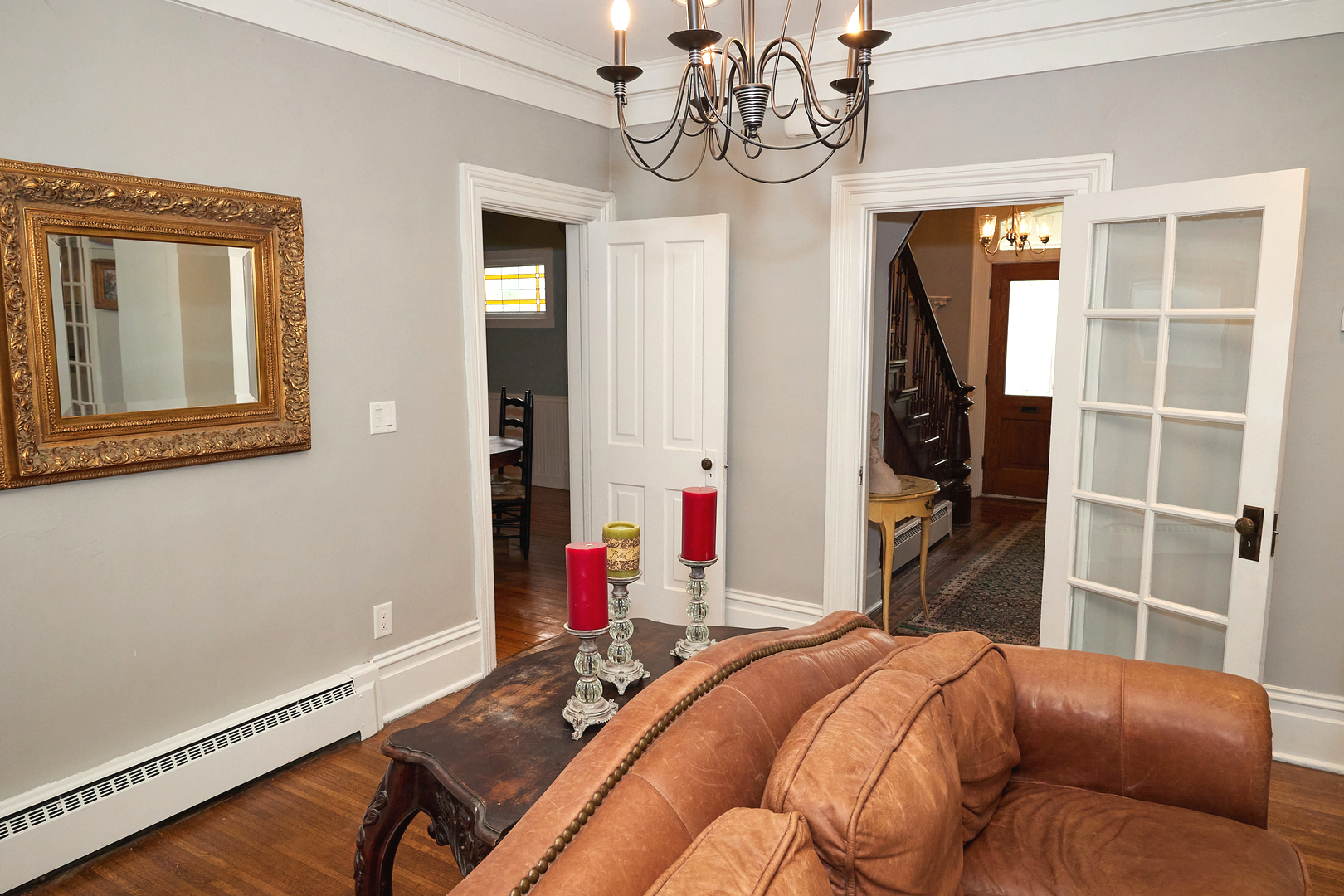 1406 Bluff Street Peru, IL 61354 - Photo 20 of 57 a bedroom with a bed and a chandelier