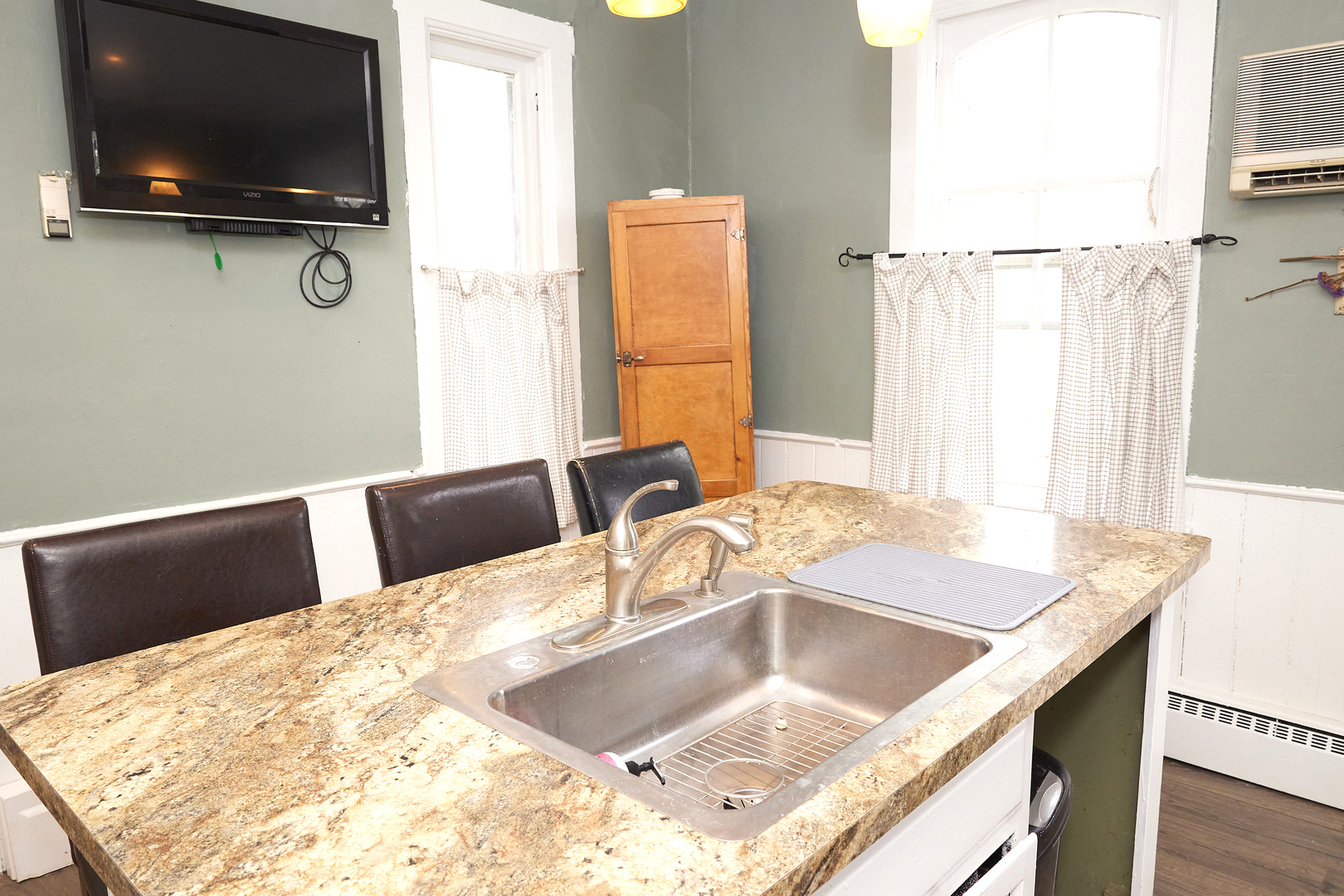 1406 Bluff Street Peru, IL 61354 - Photo 30 of 57 a view of kitchen island with sink microwave and refrigerator