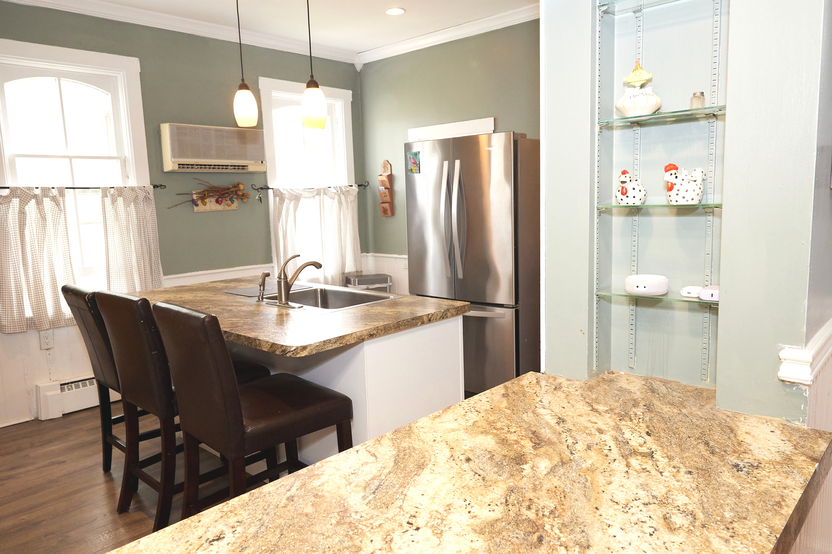1406 Bluff Street Peru, IL 61354 - Photo 32 of 57 a kitchen with a wooden floor and a refrigerator