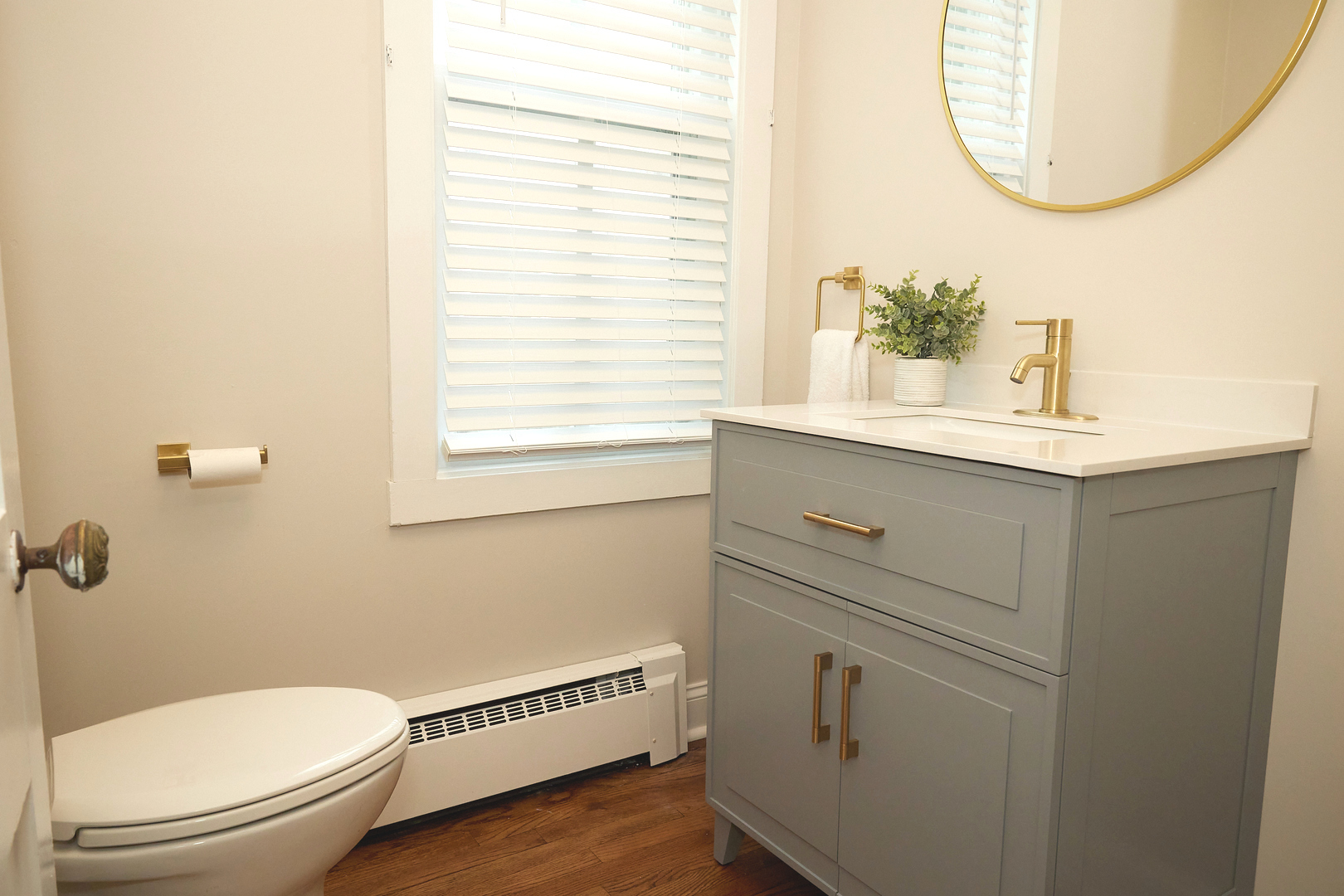 1406 Bluff Street Peru, IL 61354 - Photo 33 of 57 a bathroom with a toilet a sink a vanity and mirror