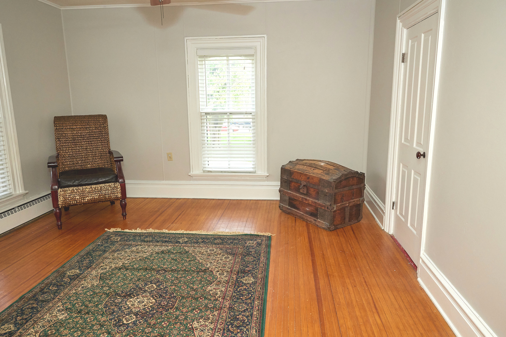1406 Bluff Street Peru, IL 61354 - Photo 38 of 57 a room with wooden floor and chair