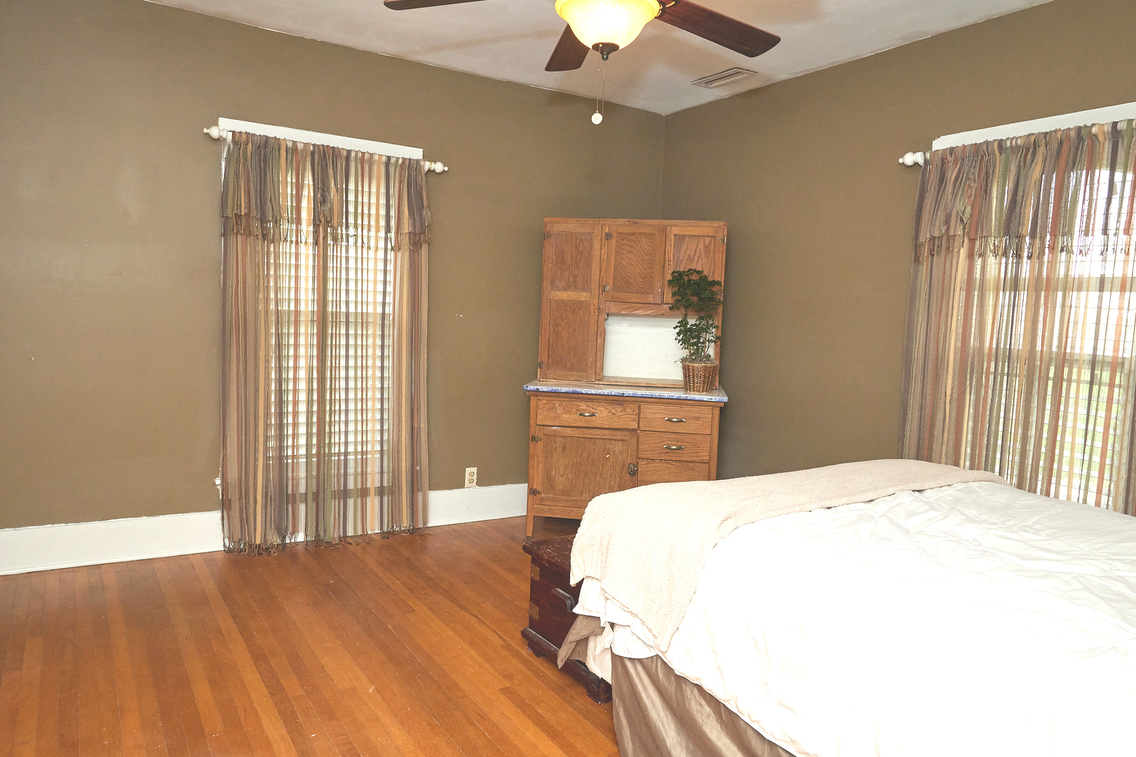 1406 Bluff Street Peru, IL 61354 - Photo 39 of 57 a spacious bedroom with a bed and a dresser