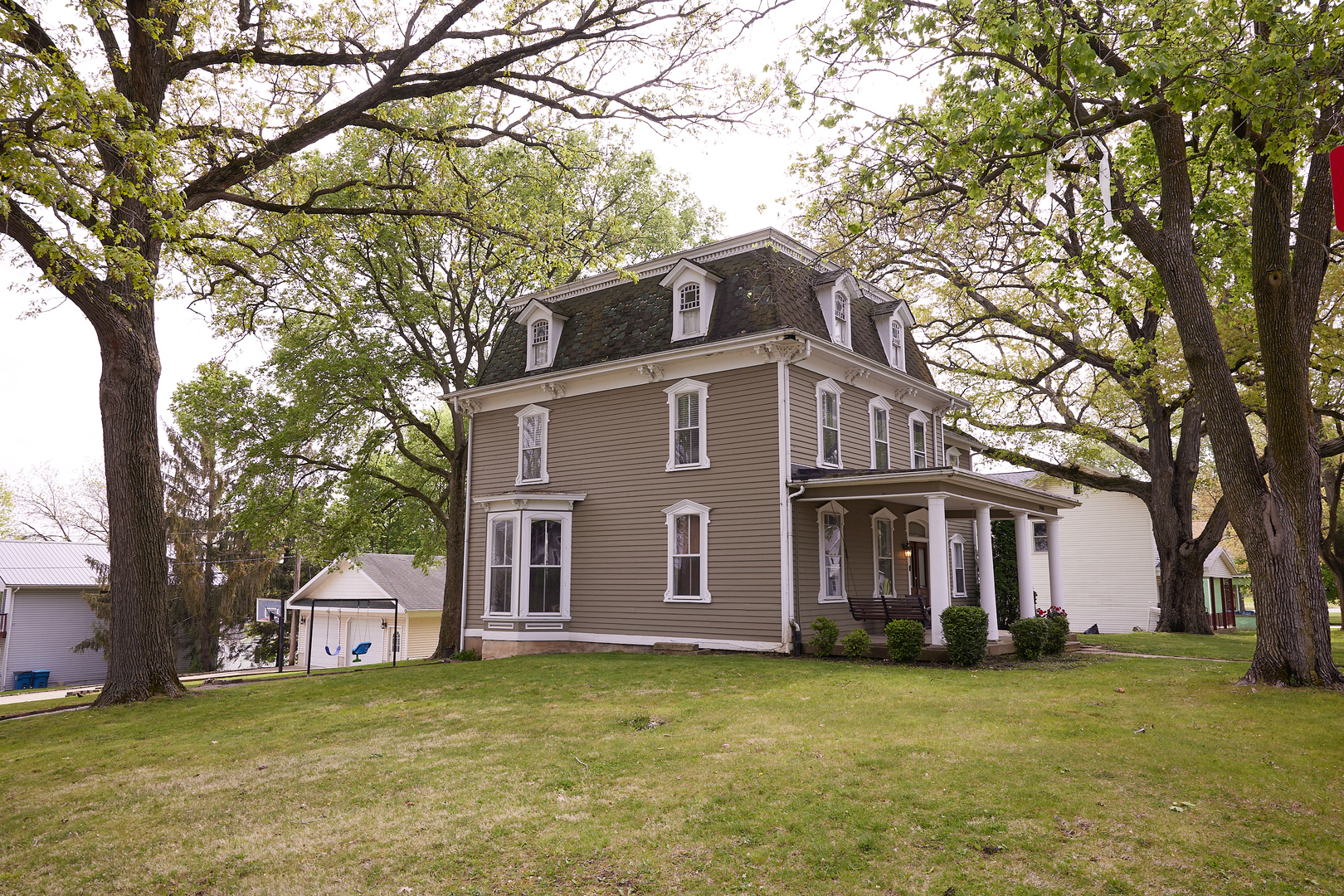 1406 Bluff Street Peru, IL 61354 - Photo 5 of 57 a view of a yard in front of a house with large trees