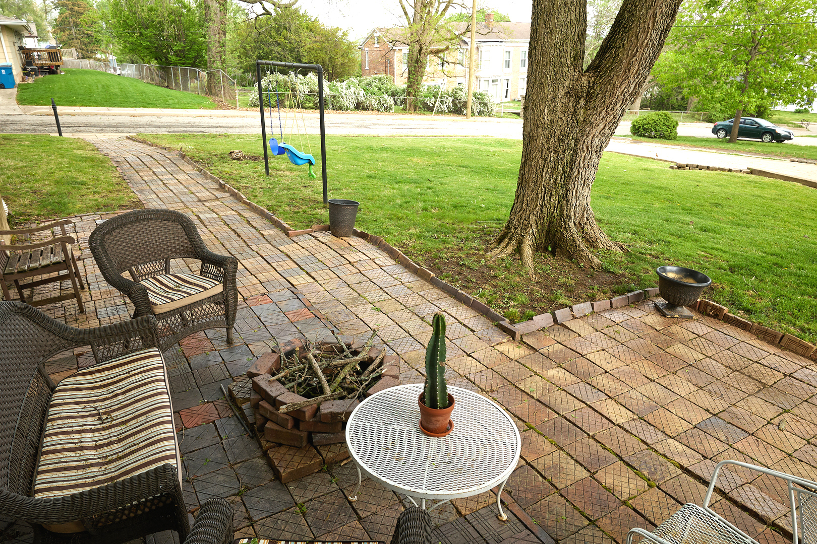 1406 Bluff Street Peru, IL 61354 - Photo 52 of 57 a patio with table and chairs and garden