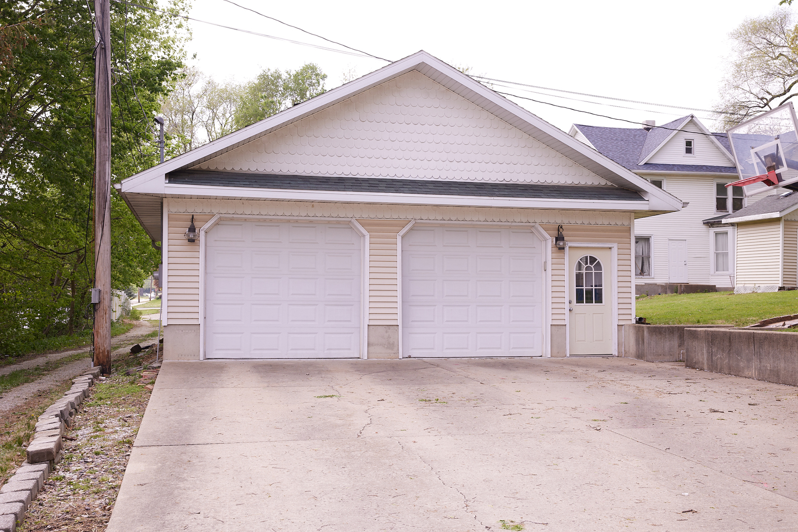 1406 Bluff Street Peru, IL 61354 - Photo 8 of 57 a front view of a house with a yard and garage