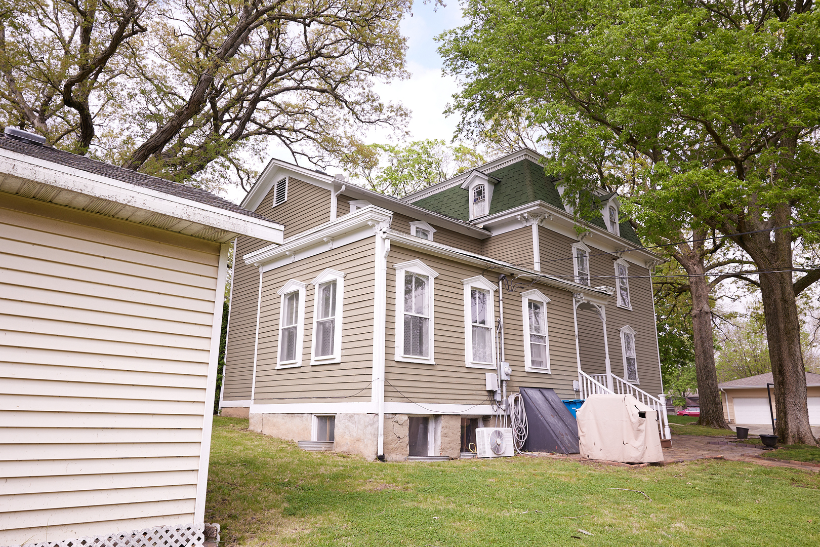 1406 Bluff Street Peru, IL 61354 - Photo 10 of 57 a front view of house with yard and trees in the background