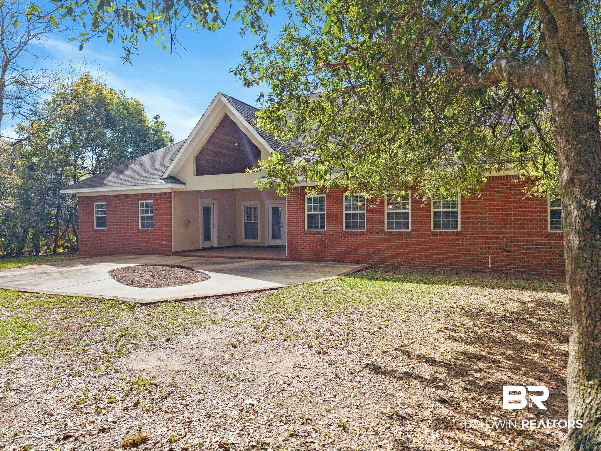 3668 Claridge Road North Mobile, AL 36608 - Photo 87 of 100 Rear view of property with brick siding and a patio area