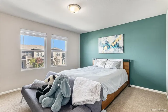 a bedroom with bed and a window