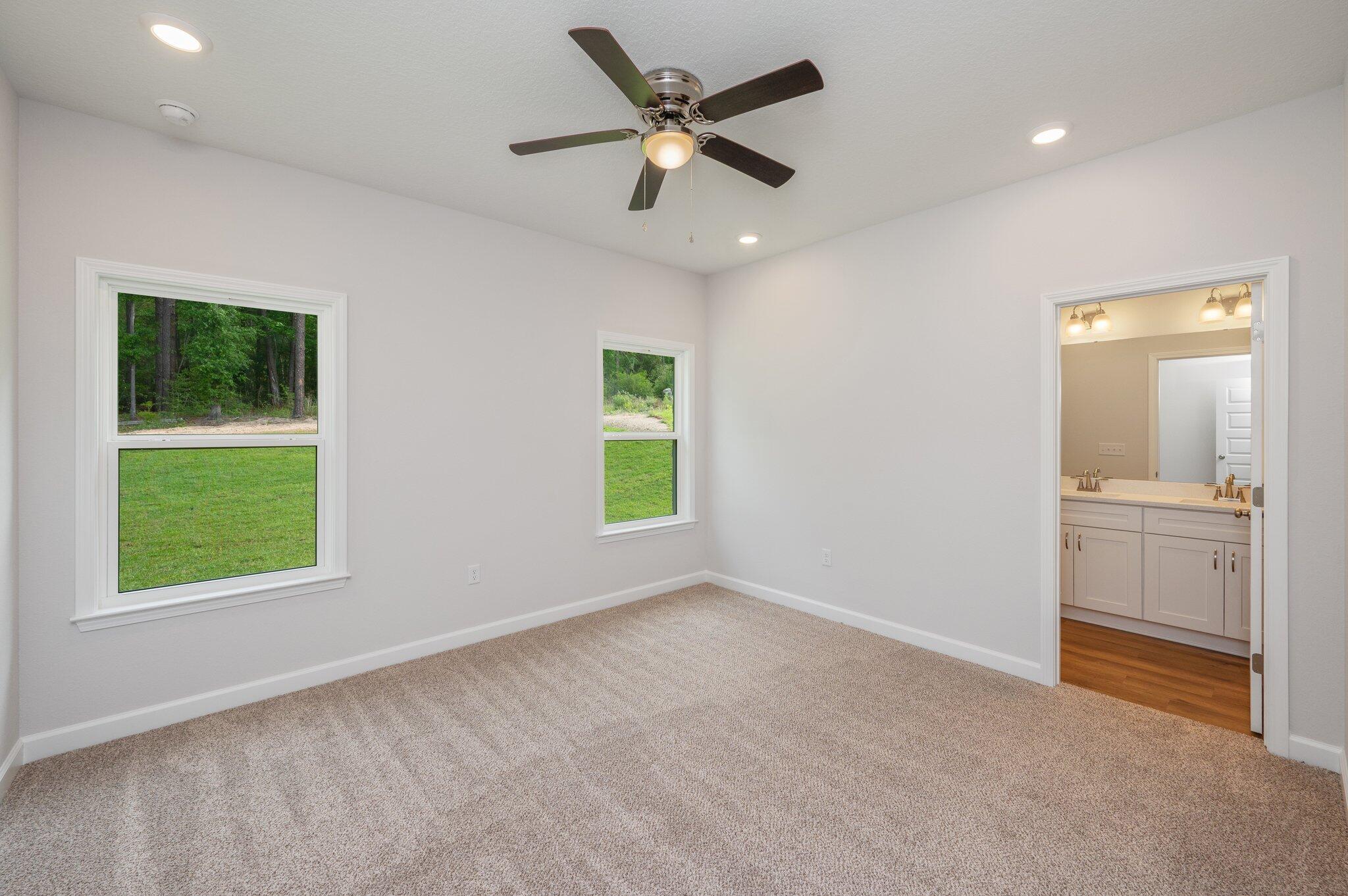 3929 Poverty Creek Road Crestview, FL 32539 - Photo 17 of 37 a view of an empty room with a window and a kitchen