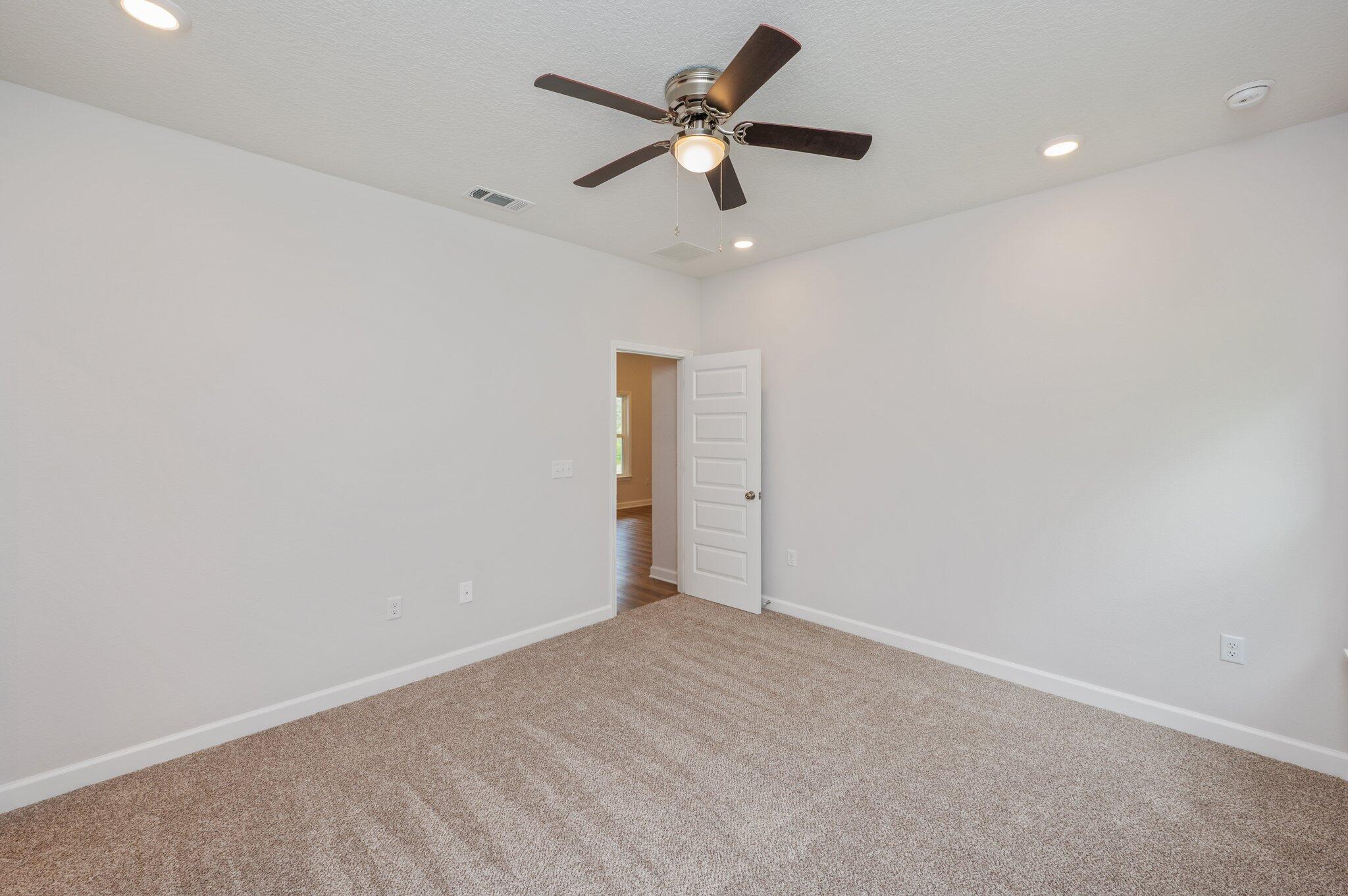 3929 Poverty Creek Road Crestview, FL 32539 - Photo 19 of 37 an empty room with a ceiling fan and a window