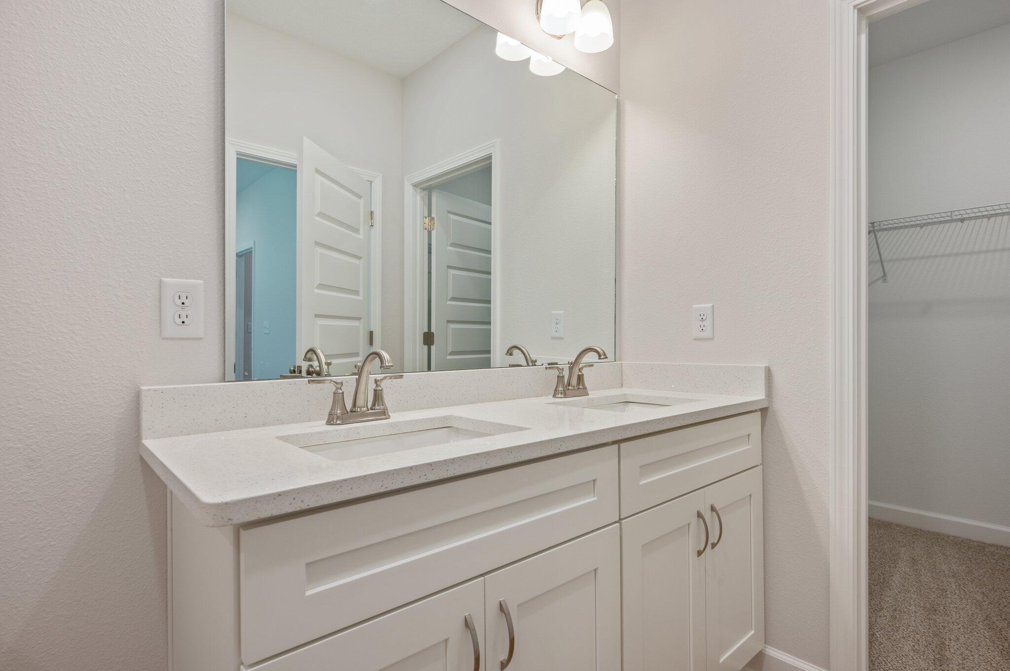 3929 Poverty Creek Road Crestview, FL 32539 - Photo 20 of 37 a bathroom with a sink and a mirror