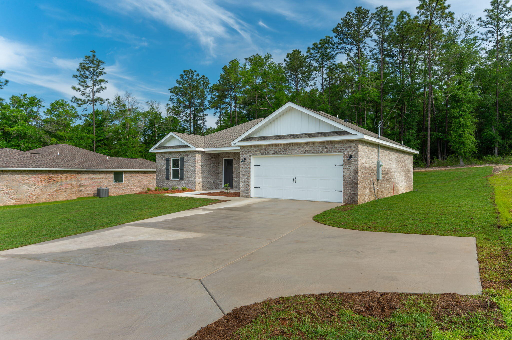 3929 Poverty Creek Road Crestview, FL 32539 - Photo 2 of 37 a front view of a house with garden