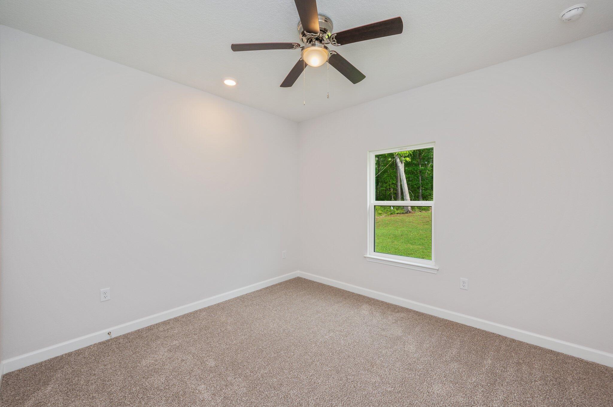3929 Poverty Creek Road Crestview, FL 32539 - Photo 25 of 37 an empty room with a window and a fan