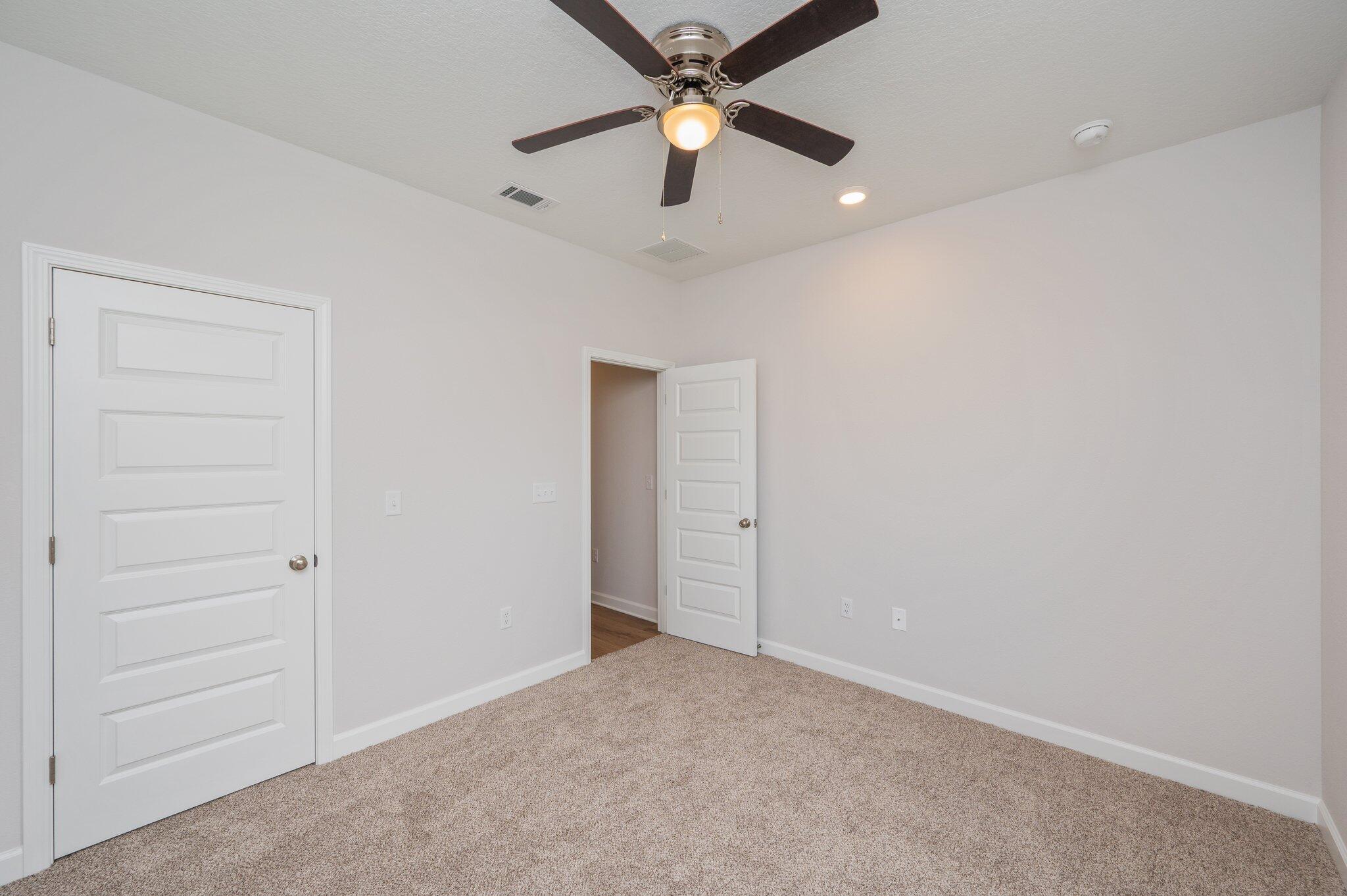 3929 Poverty Creek Road Crestview, FL 32539 - Photo 27 of 37 an empty room with closet and a ceiling fan