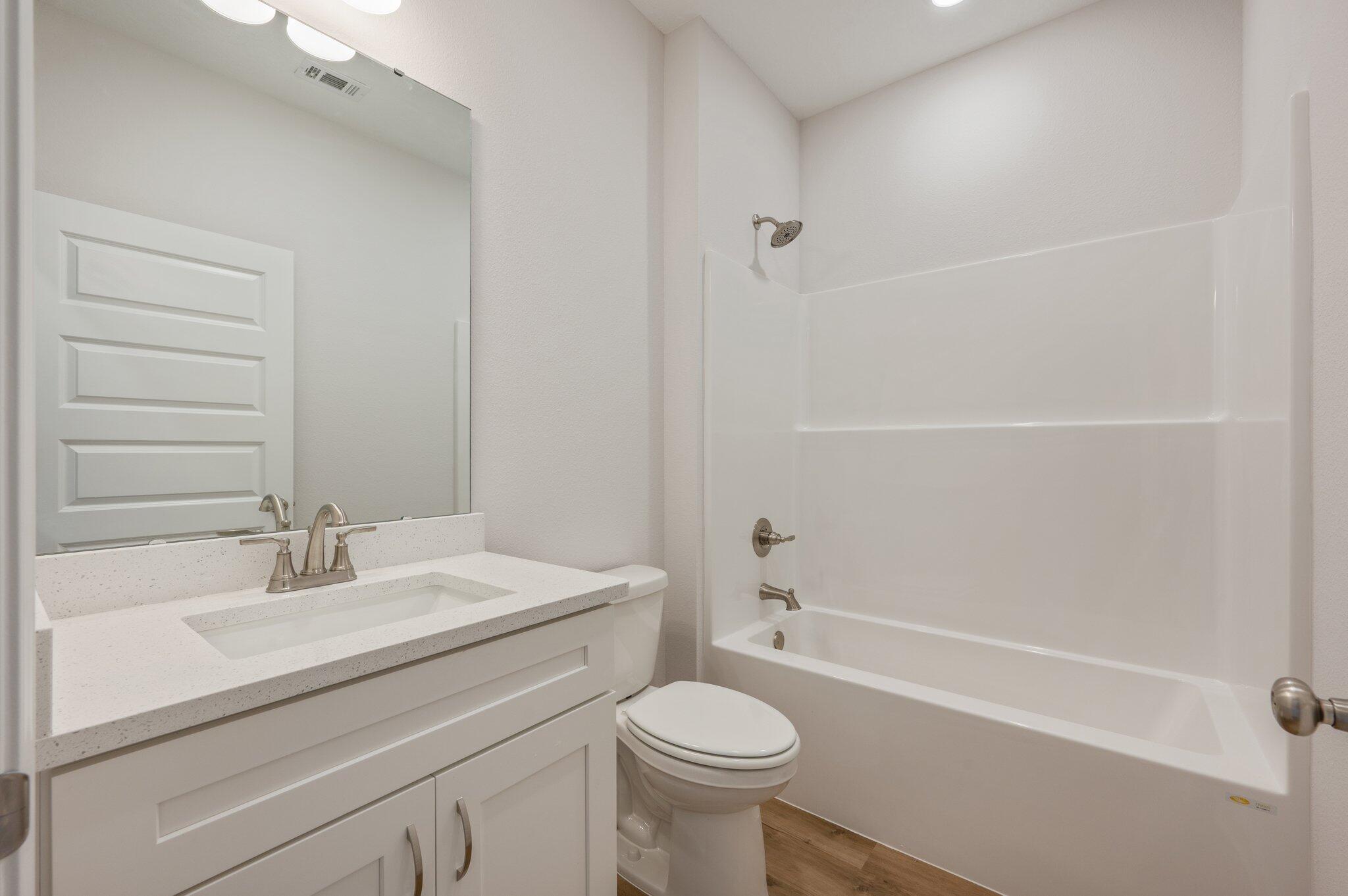 3929 Poverty Creek Road Crestview, FL 32539 - Photo 28 of 37 a bathroom with a sink toilet and shower