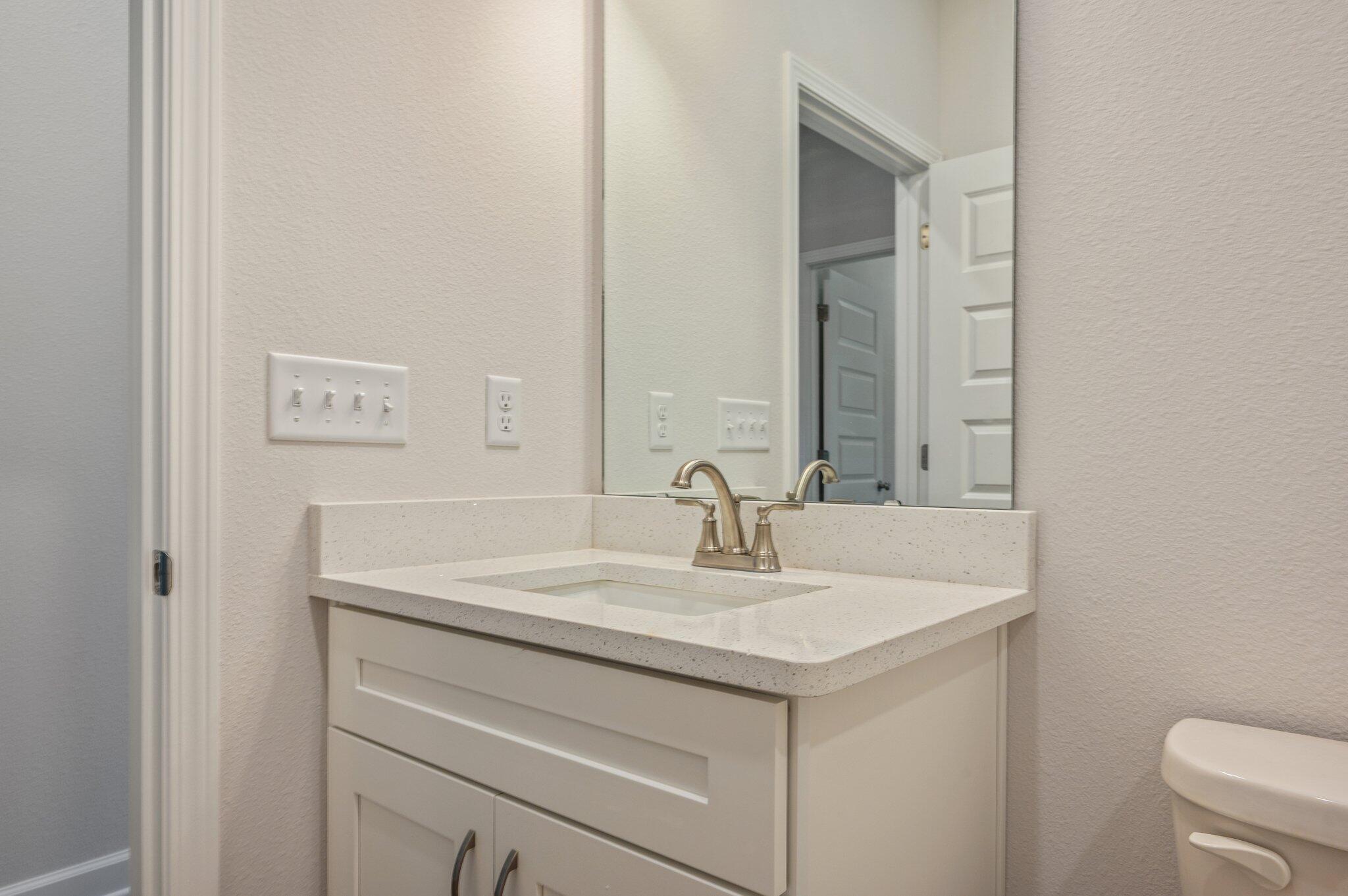 3929 Poverty Creek Road Crestview, FL 32539 - Photo 30 of 37 a bathroom with a sink and a toilet