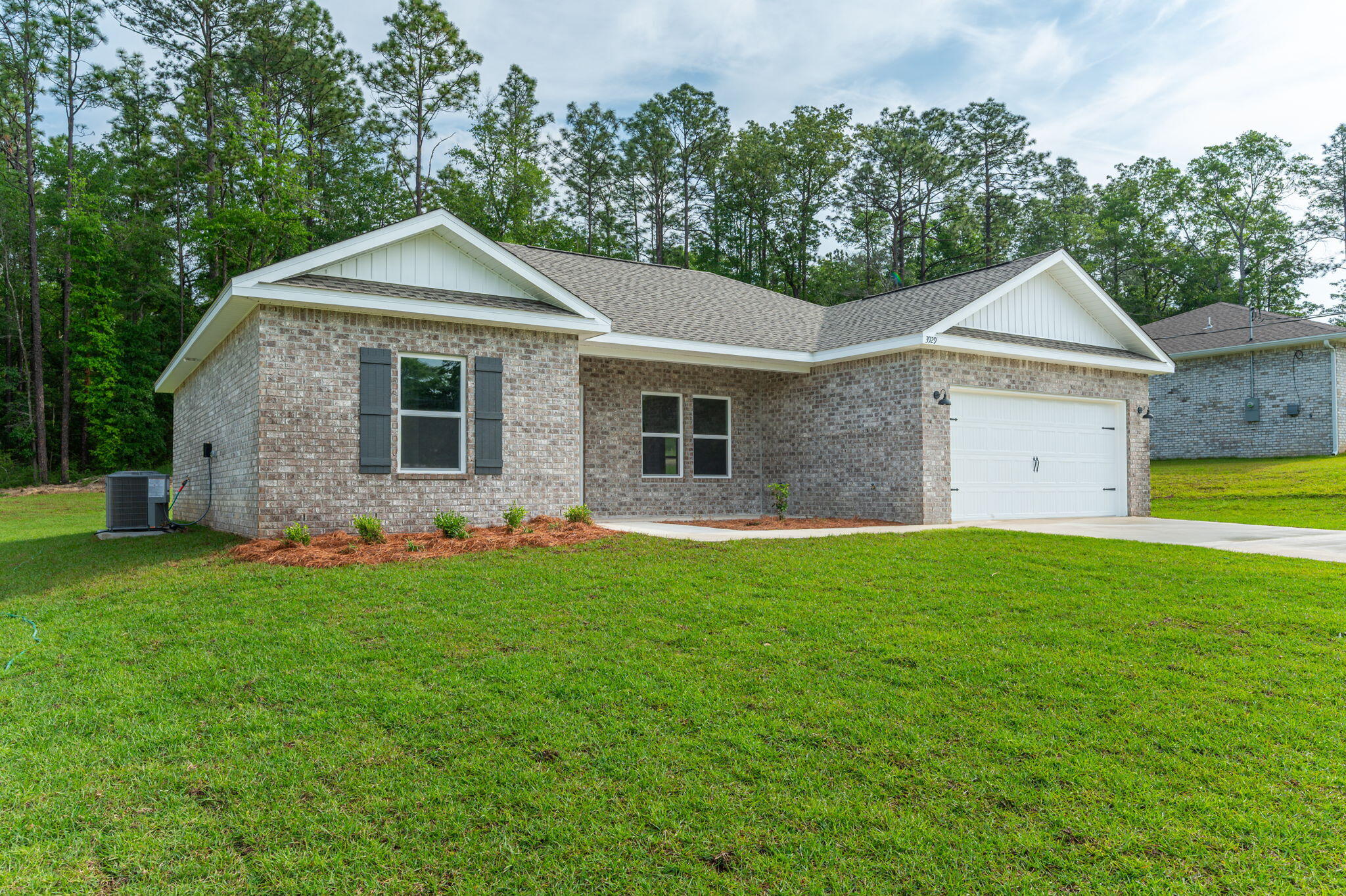 3929 Poverty Creek Road Crestview, FL 32539 - Photo 3 of 37 a front view of a house with a yard
