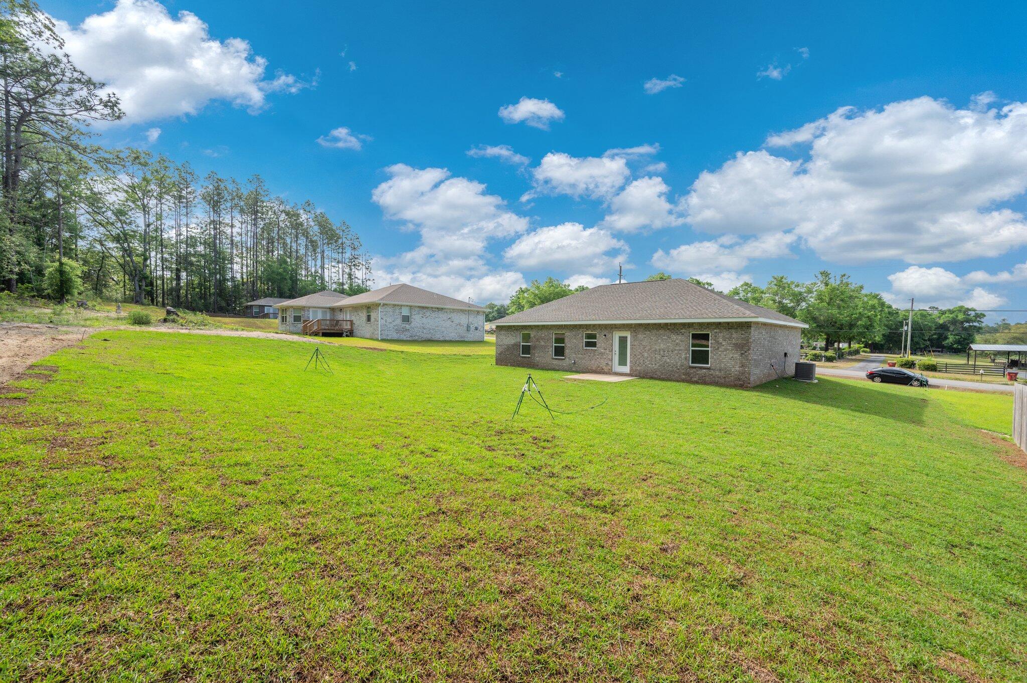 3929 Poverty Creek Road Crestview, FL 32539 - Photo 35 of 37 a view of a house with a yard