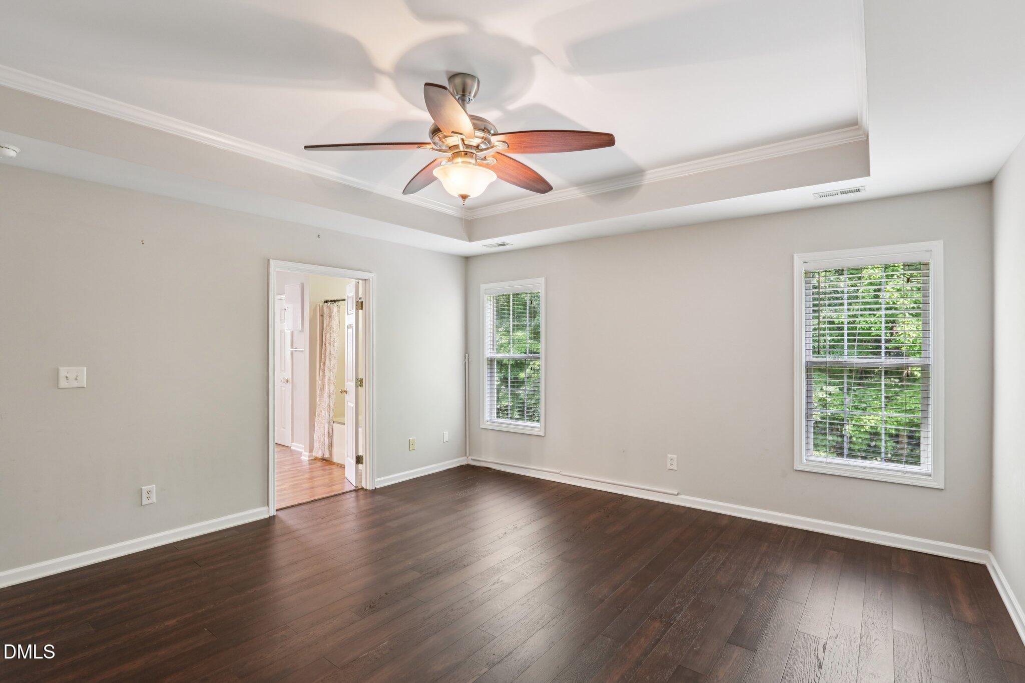 1212 Southgate Drive Raleigh, NC 27610 - Photo 15 of 31 a view of an empty room with wooden floor and a window