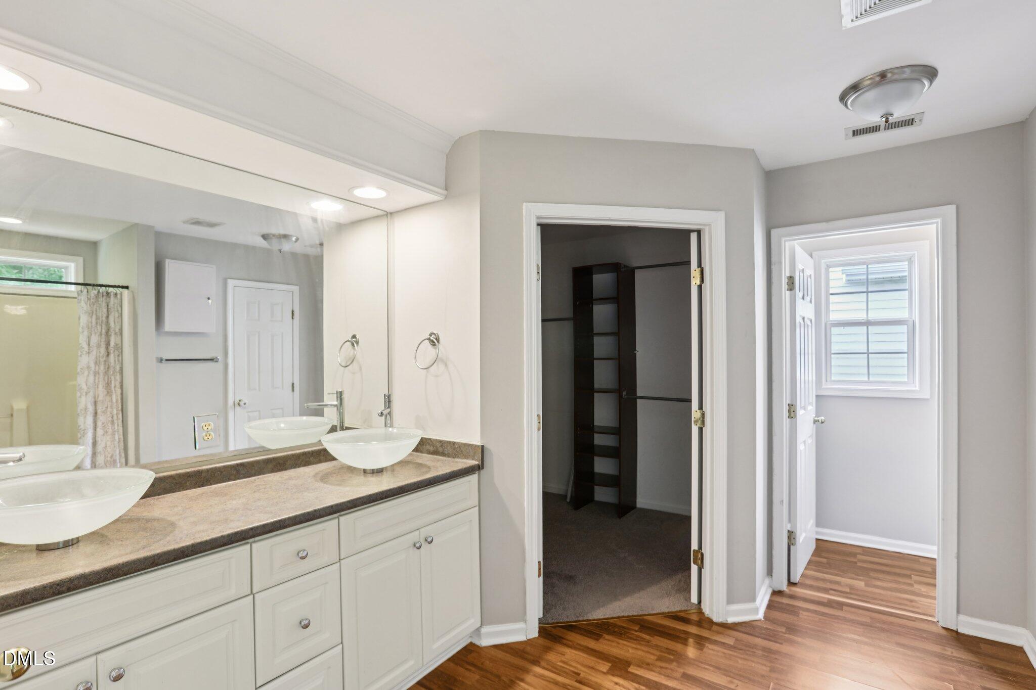 1212 Southgate Drive Raleigh, NC 27610 - Photo 16 of 31 a bathroom with a sink and a mirror