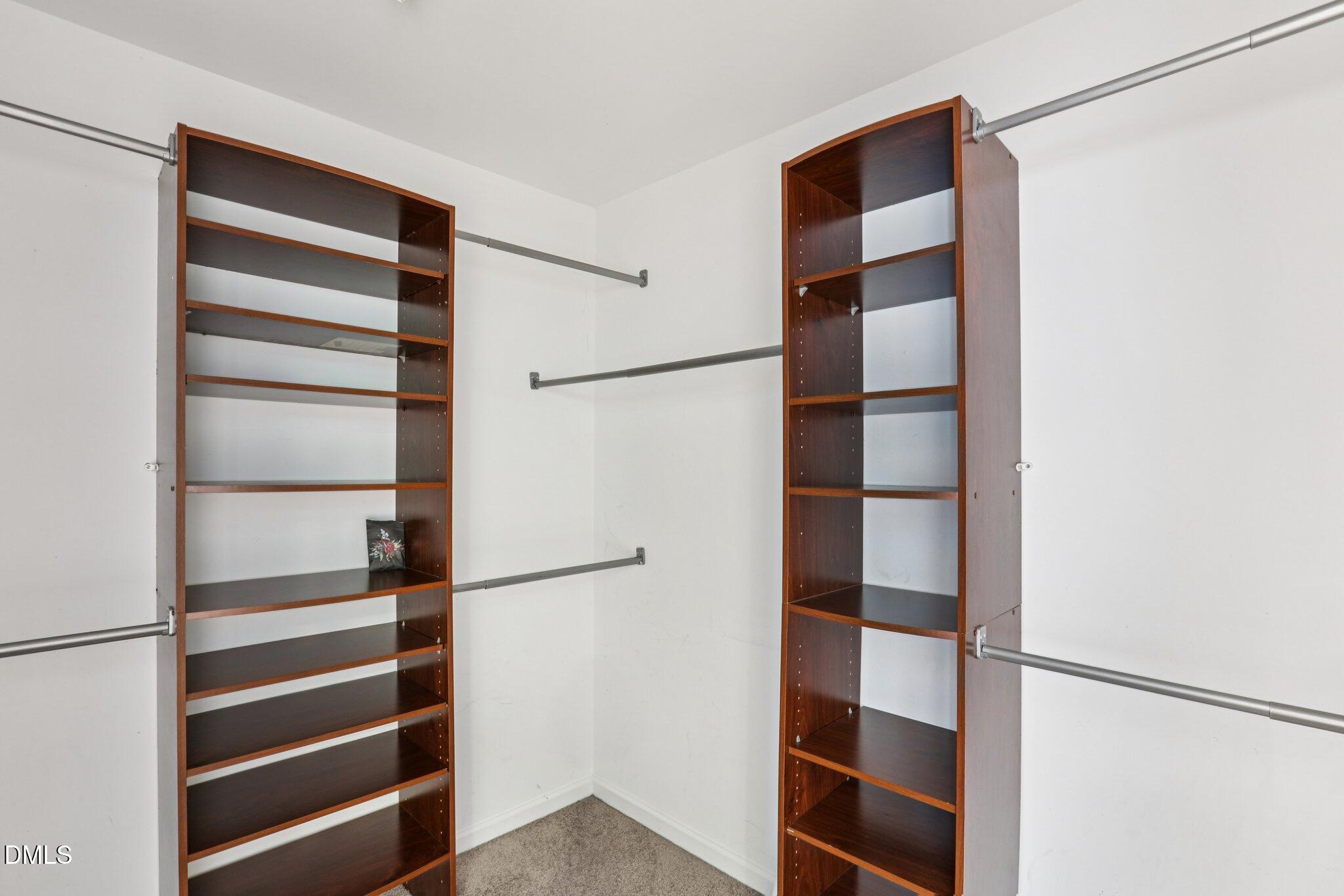 1212 Southgate Drive Raleigh, NC 27610 - Photo 17 of 31 a view of walk in closet with empty racks